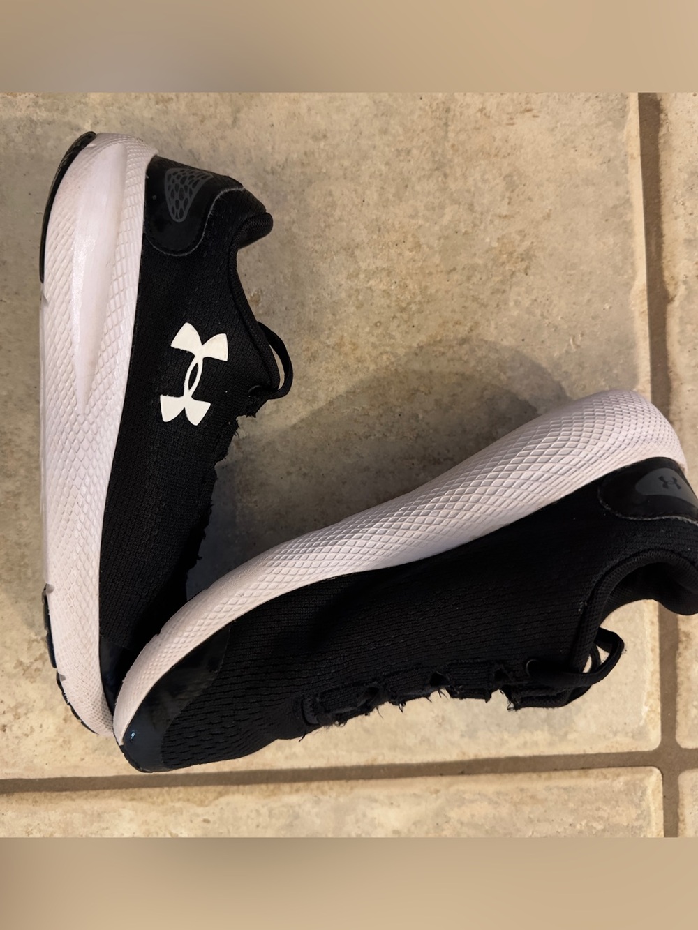 Under Armour Kids Black Athletic Running Shoes with White Soles